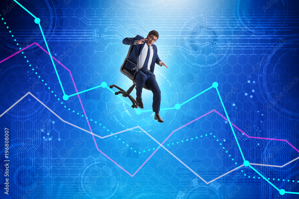 Businessman sliding down on chair in economic crisis concept Businessman sliding down on chair in economic crisis concept