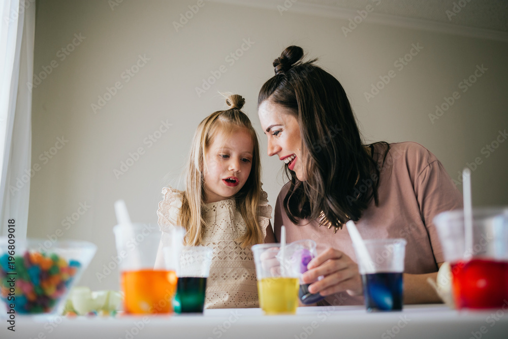 Mother and Daughter Painting Easter Eggs together Mother and Daughter Painting Easter Eggs together