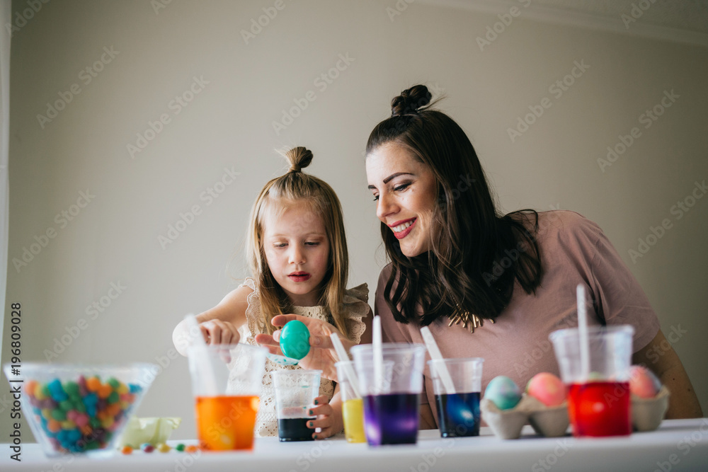 Mother and Daughter Painting Easter Eggs together Mother and Daughter Painting Easter Eggs together