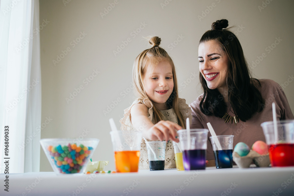 Mother and Daughter Painting Easter Eggs together Mother and Daughter Painting Easter Eggs together