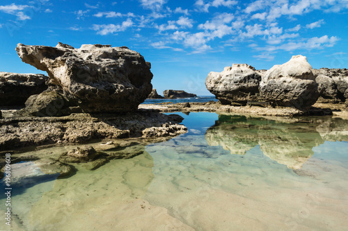 Rock formation with reflections in the sea at Peterborough beach along the Great Ocean Road, Victoria, Australia