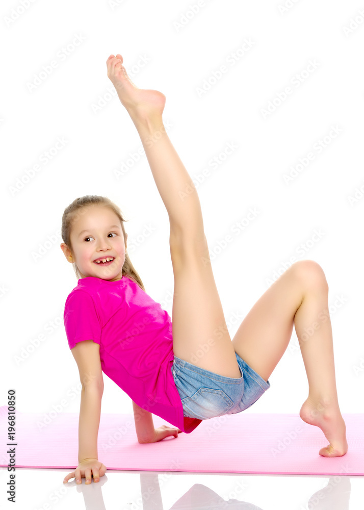 The gymnast perform an acrobatic element on the floor. The gymnast perform an acrobatic element on the floor.