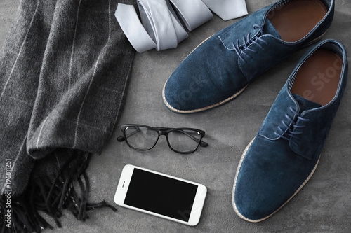 Composition with stylish men's shoes on gray background