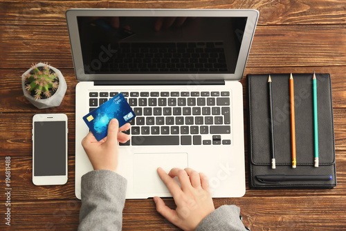 Woman with credit card usin...