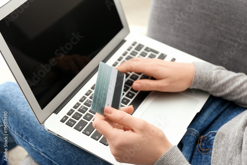 Woman with credit card usin...