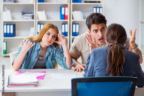 Young family dissappointed at high interest mortgage rate in bank