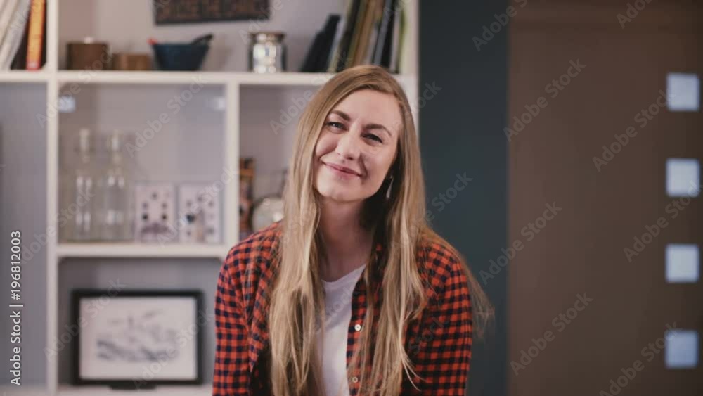 Beautiful woman looking at camera smiling. Attractive young blonde with long hair smiles happy. Shy and reserved. 4K. Beautiful woman looking at camera smiling. Attractive young blonde with long hair smiles happy. Shy and reserved. 4K.