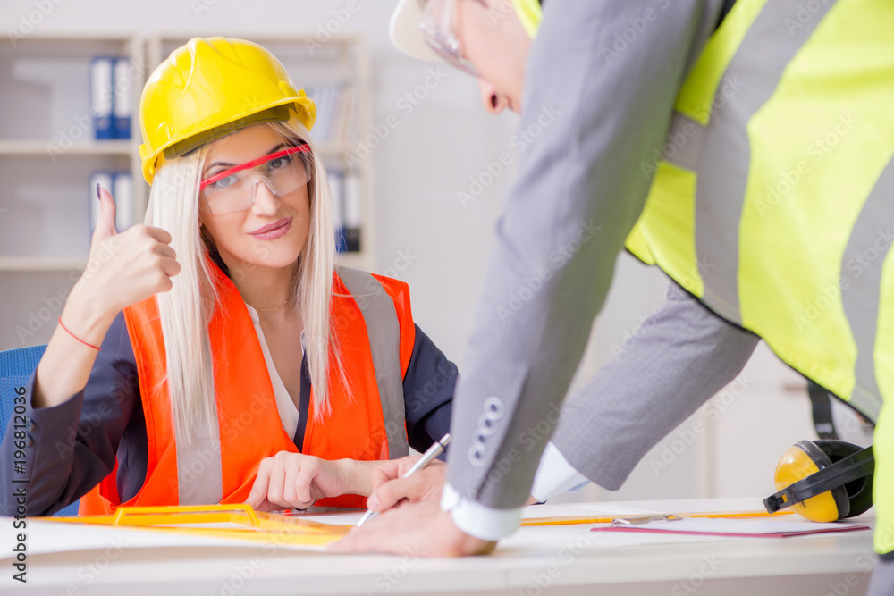 Construction workers having discussion in office before starting Construction workers having discussion in office before starting