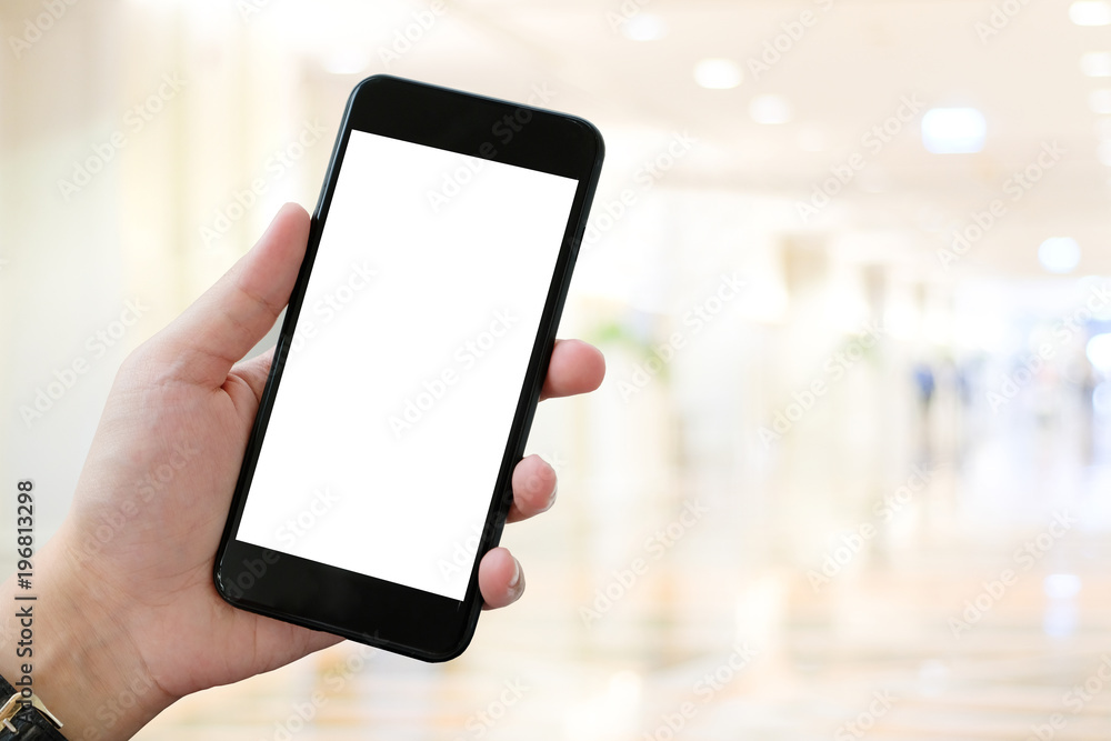 Hand using smart phone with blank screen over blur bokeh light background, business and technology, internet of things concept Hand using smart phone with blank screen over blur bokeh light background, business and technology, internet of things concept