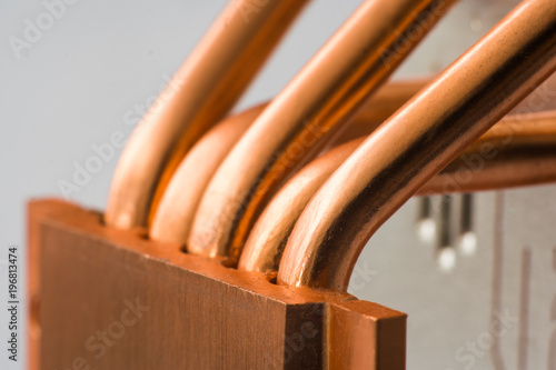 Aluminum radiator with copper heat pipe close-up with beautiful bokeh photo