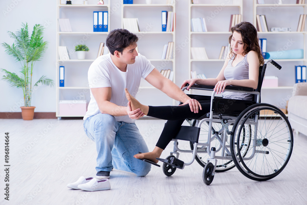 Patient undergoing rehabilitation recovery programme with doctor Patient undergoing rehabilitation recovery programme with doctor