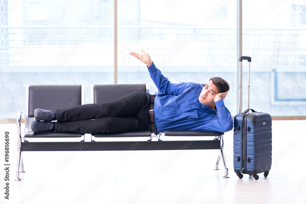 Man wairing to boarding in airport lounge room Man wairing to boarding in airport lounge room