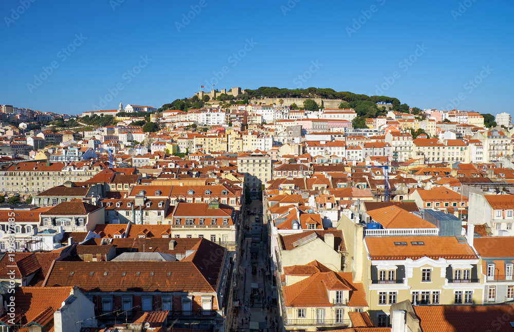 The residential houses of Alfama with Saint George Castle on the background. Lisbon. Portugal