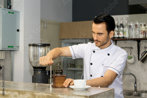Barista is making coffee in a coffee shop.