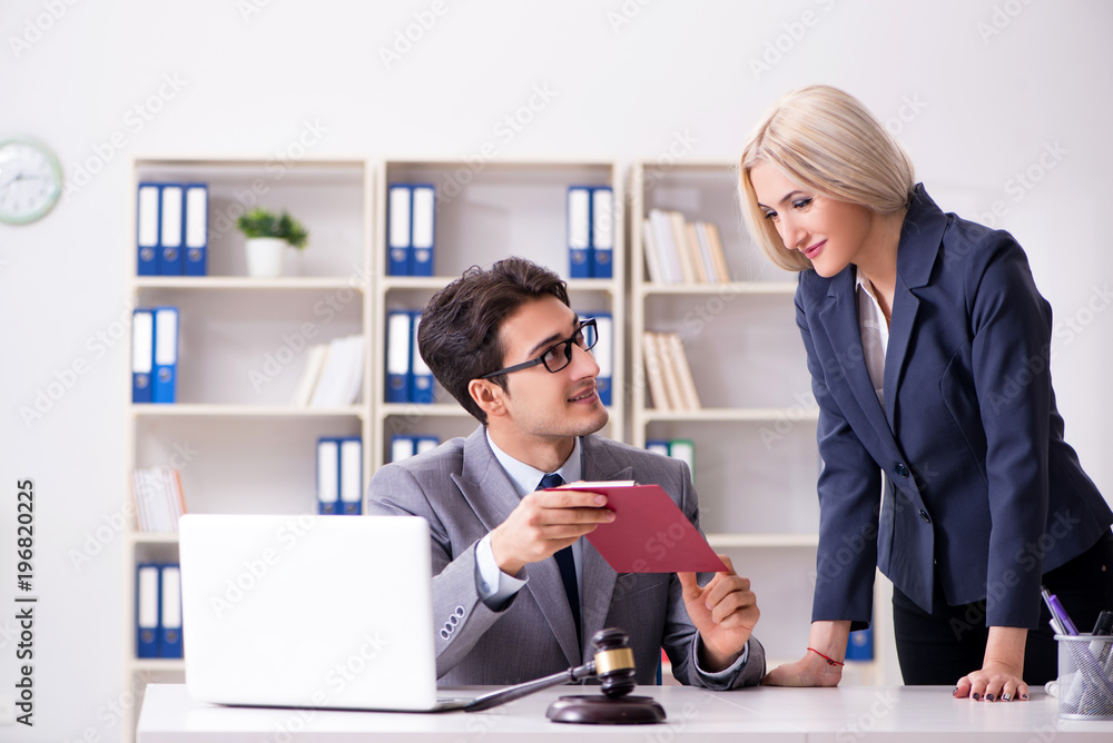 Lawyer discussing legal case with client Lawyer discussing legal case with client
