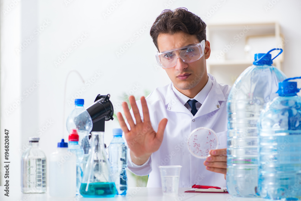 Lab assistant testing water quality Lab assistant testing water quality