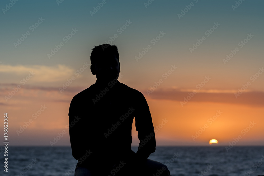 Silhoute - A person enjoying sunset Silhoute - A person enjoying sunset