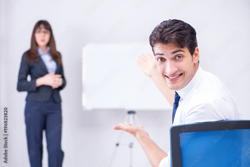 Business presentation in the office with man and woman Business presentation in the office with man and woman