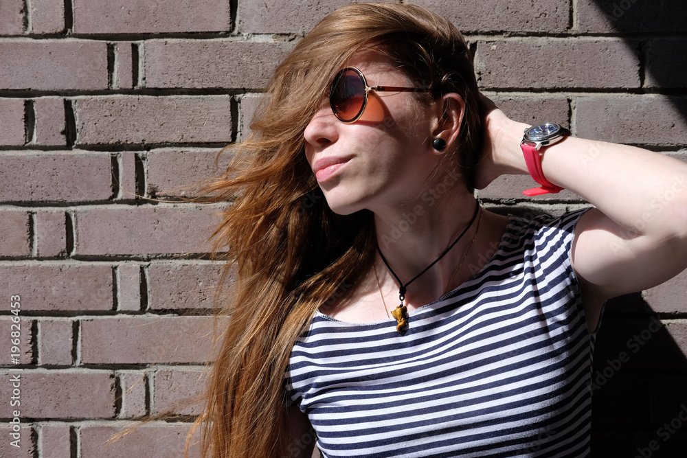 portrait of young redhead woman in sunglasses portrait of young redhead woman in sunglasses