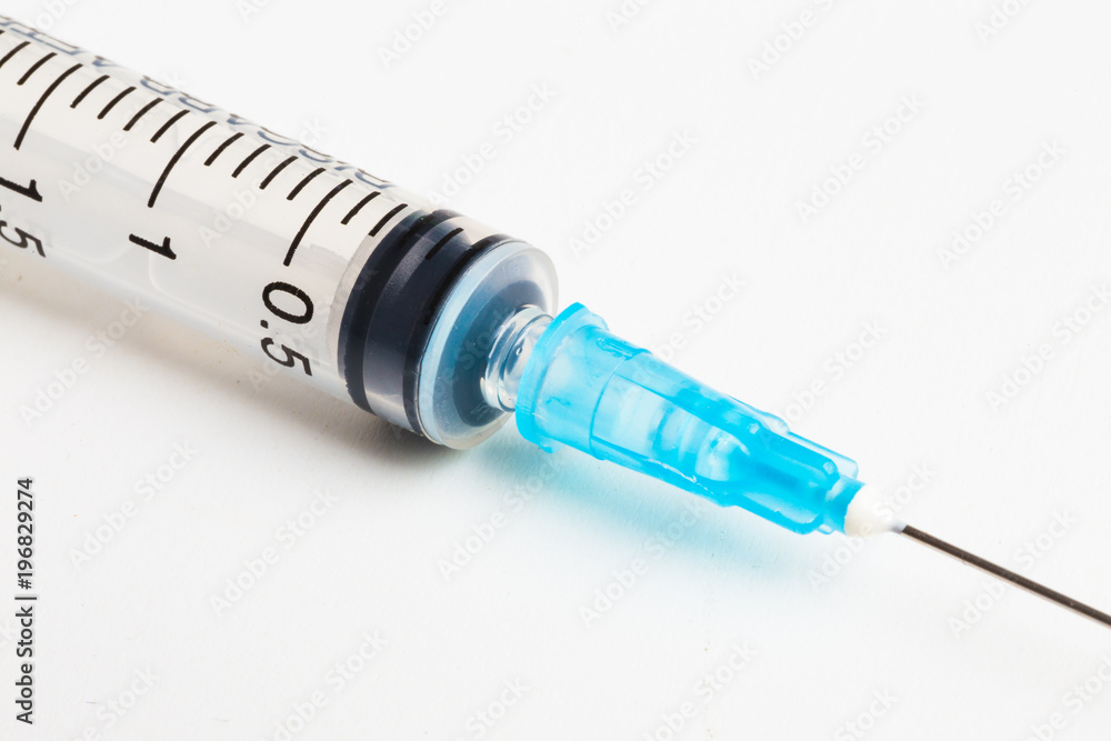 Disposable syringe in the row Disposable syringe in the row