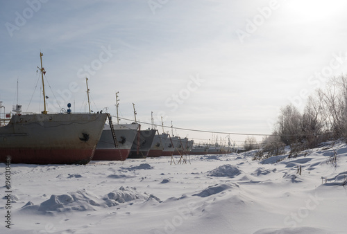 ships stand in a row in winter parking © Valeriy