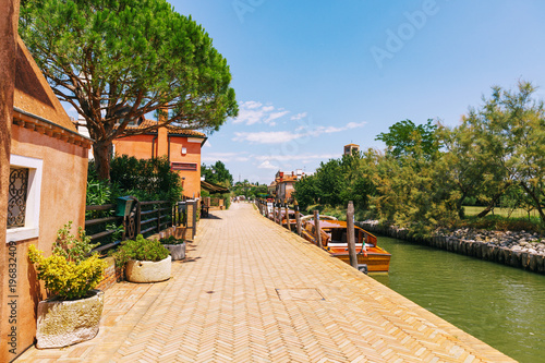 Tiny Torcello island has few residents but it's often busy with sightseers in summer near Venice, Italy photo