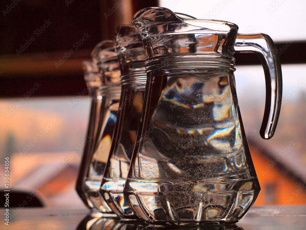 a row of glass jugs