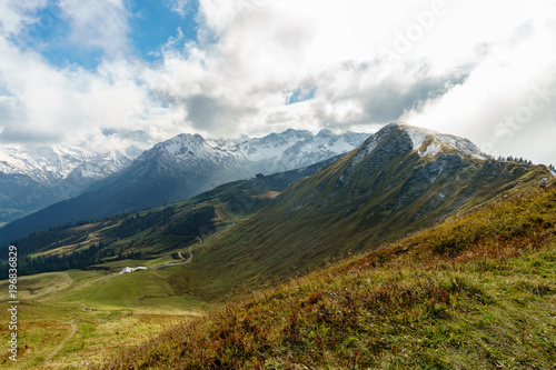 Hiking trail in the mountain landscape of the Allgau Alps on the Fellhorn and clouds