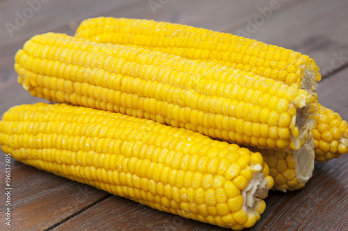 Close-up corn on wooden table photo