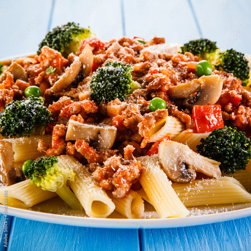Penne with meat, tomato sauce and vegetables Penne with meat, tomato sauce and vegetables