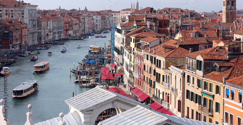 Venice Italy Grand Canal and Rialto Bridge with many boats photo