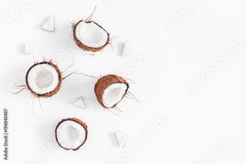 Coconut background. Fresh coconuts on white background. Flat lay, top view, copy space