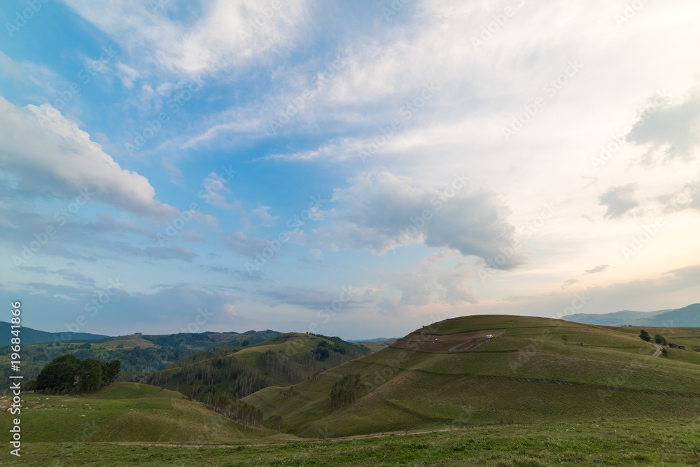 Beautiful mountain landscape with trees and a cloudy morning sky, Dumesti, Salciua, Apuseni, Romania Beautiful mountain landscape with trees and a cloudy morning sky, Dumesti, Salciua, Apuseni, Romania