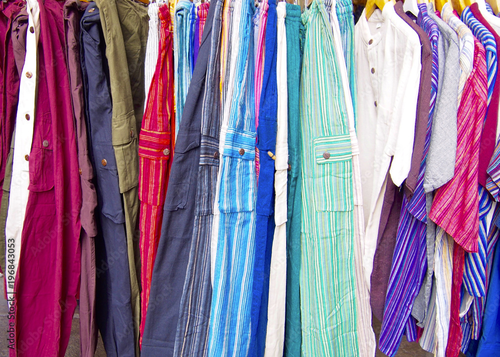 Group of pants and shirts in the store