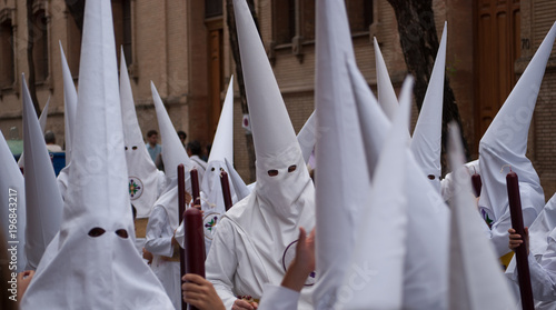 the processions of the hooded dressed in white