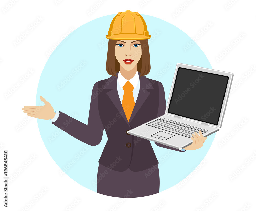 Businesswoman in construction helmet holding a laptop notebook and piggy bank Businesswoman in construction helmet holding a laptop notebook and piggy bank