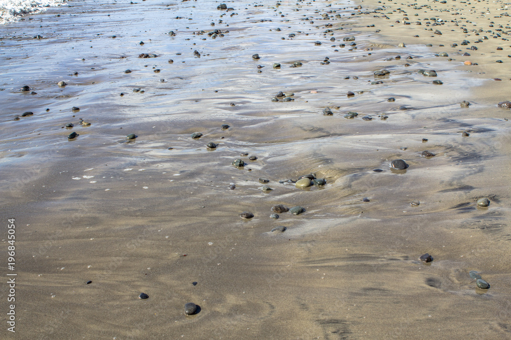 Sand beach with sea stones Sand beach with sea stones