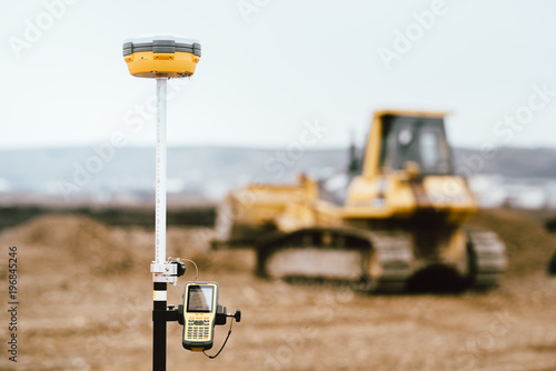 Surveyor equipment GPS system outdoors at highway construction site. Surveyor engineering with surveying equipement photo
