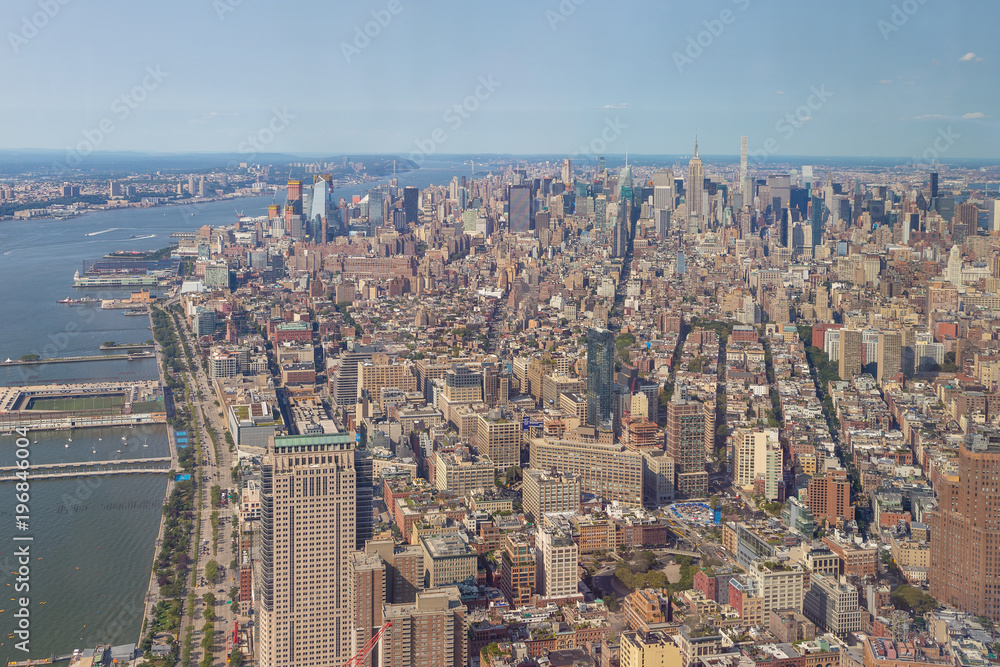 Aerial view of Manhattan skyline on a sunny summer day.