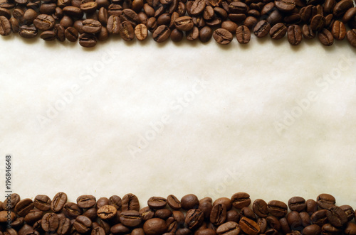 Obraz na płótnie Coffee beans on old burnt paper background w salonie