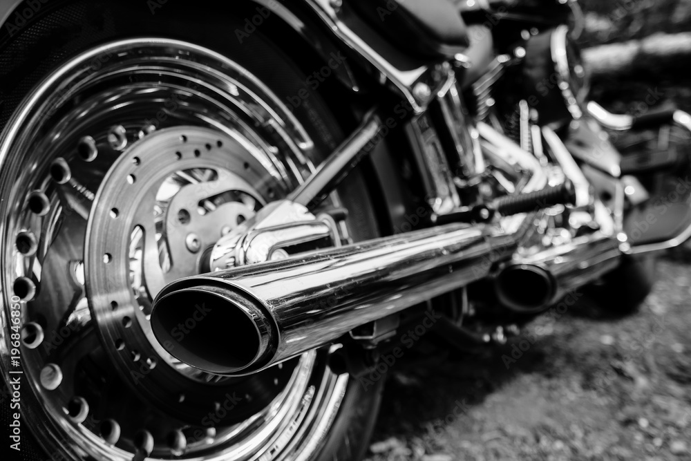 Rear view of motorcycle exhaust chrome pipes