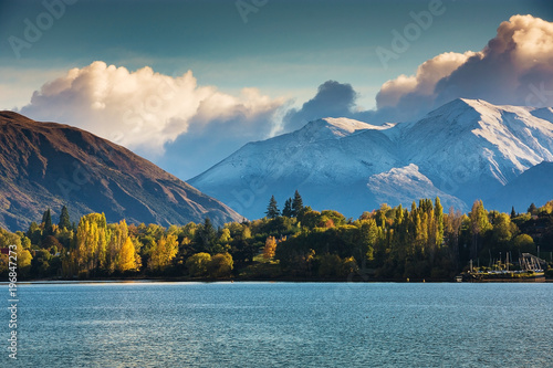 First snow in Wanaka, south island, New Zealand with colorful tree, mountain and lake.