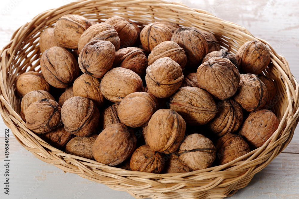 walnuts in small wicker basket walnuts in small wicker basket