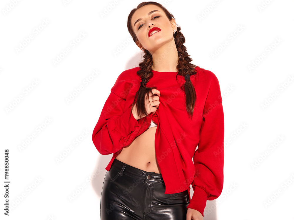 Portrait of young happy smiling woman model with bright makeup and colorful lips with two horns and sunglasses in summer red clothes isolated on white. Going crazy Portrait of young happy smiling woman model with bright makeup and colorful lips with two horns and sunglasses in summer red clothes isolated on white. Going crazy