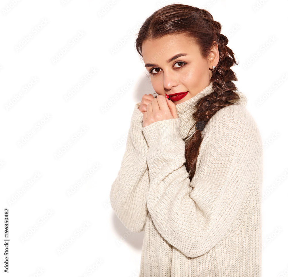 Portrait of young happy smiling woman model with bright makeup and red lips with two horns in summer warm sweater clothes isolated on white. Going crazy Portrait of young happy smiling woman model with bright makeup and red lips with two horns in summer warm sweater clothes isolated on white. Going crazy