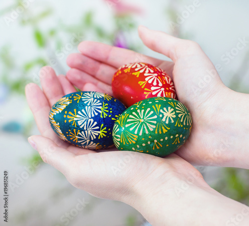 Colorful easter eggs in girl hands