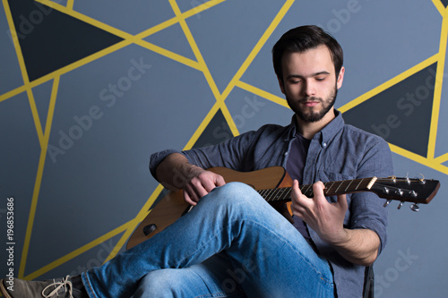 young handsome guy with guitar