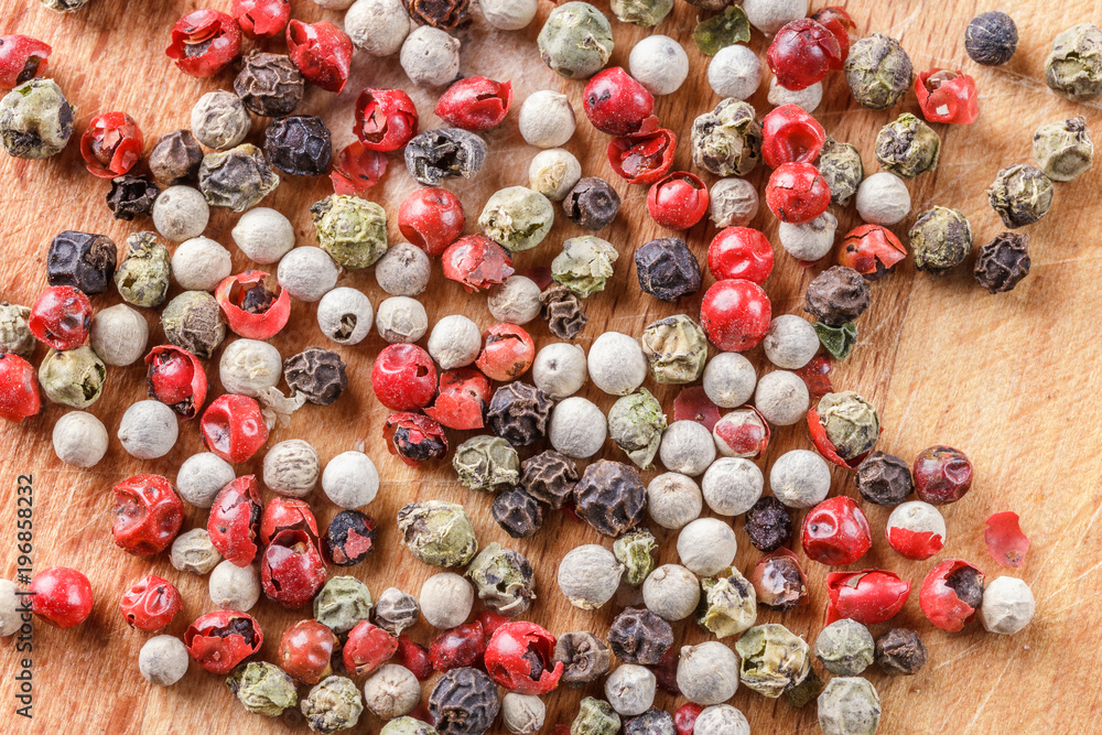 The pepper mix on a wooden background The pepper mix on a wooden background