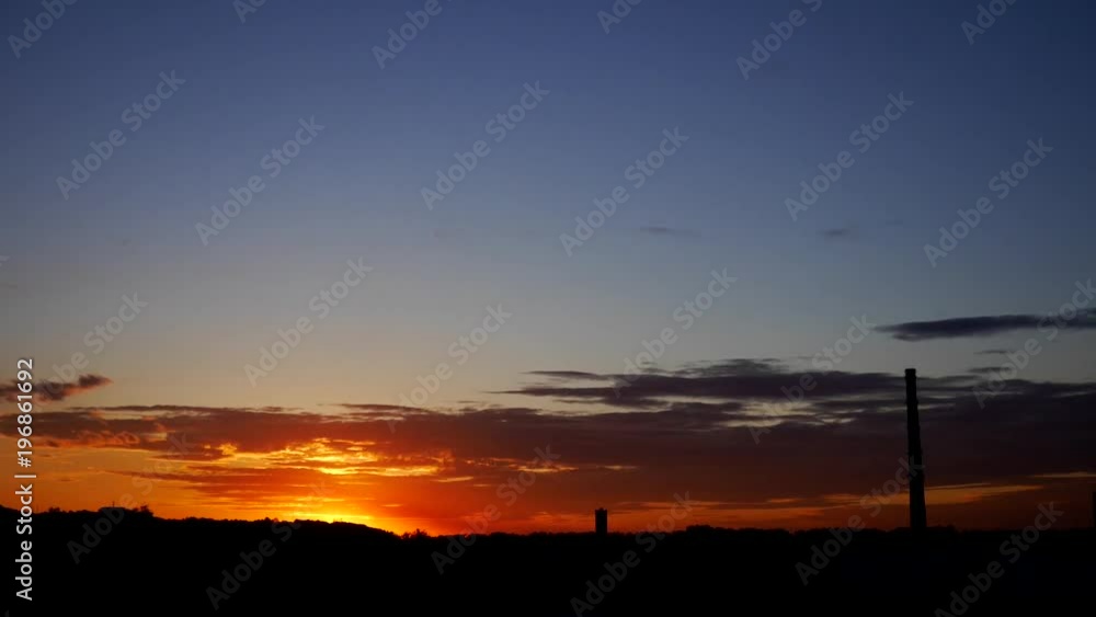 Time lapse beautiful orange sunset pipe silhouette Time lapse beautiful orange sunset pipe silhouette