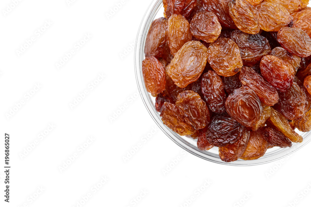 bowl of raisins on a white background. Dried grapes. bowl of raisins on a white background. Dried grapes.